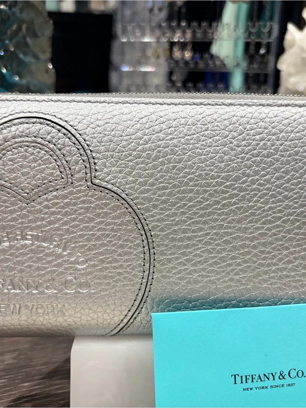 Tiffany & Co. Metallic Silver Zip-Around Pebbled Leather Wallet